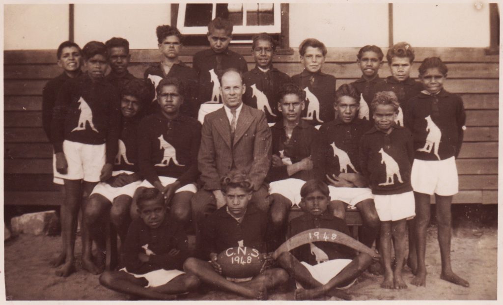 The 1948 Carrolup School football team with their teacher, Noel White.