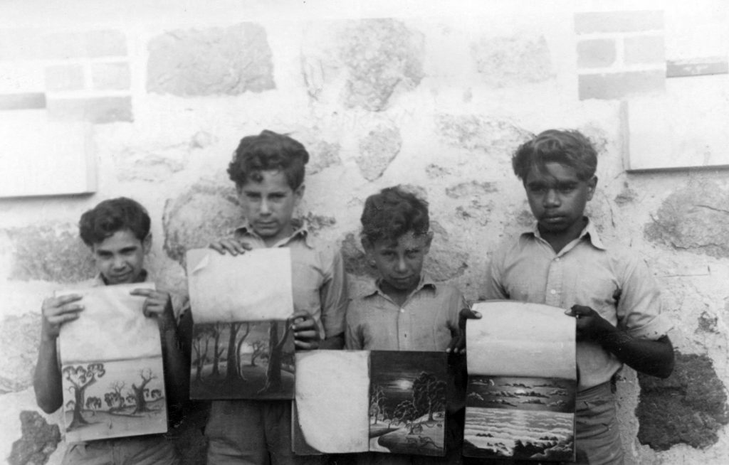 Four unidentified Carrolup boys with their pastel drawing books. Photographer: Vera Hack, January 1950. Noel & Lily White Collection.