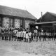 The boys and girls of Carrolup outside their school classrooms. Photographer: Noel White in 1948/49. Noel & Lily White Collection.