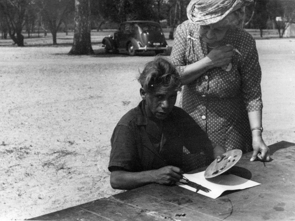 Parnell Dempster working on his first oil painting under the tuition of Mrs Rutter. Photographer: Vera Hack, January 1950. Noel & Lily White Collection.